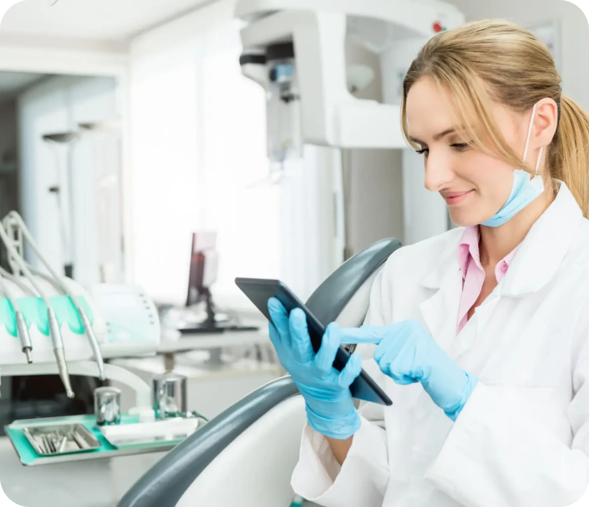 Female dentist checking tablet